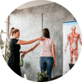 chiropractor-treating-patient-in-office@2x